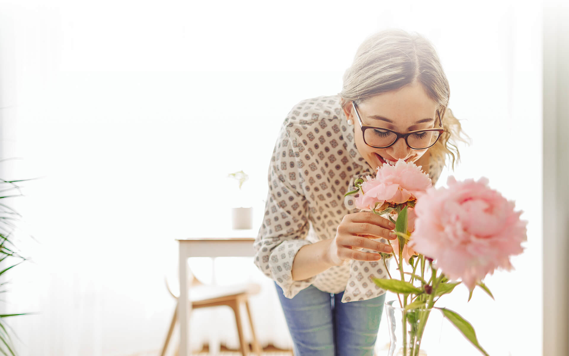 woman smelling flowers