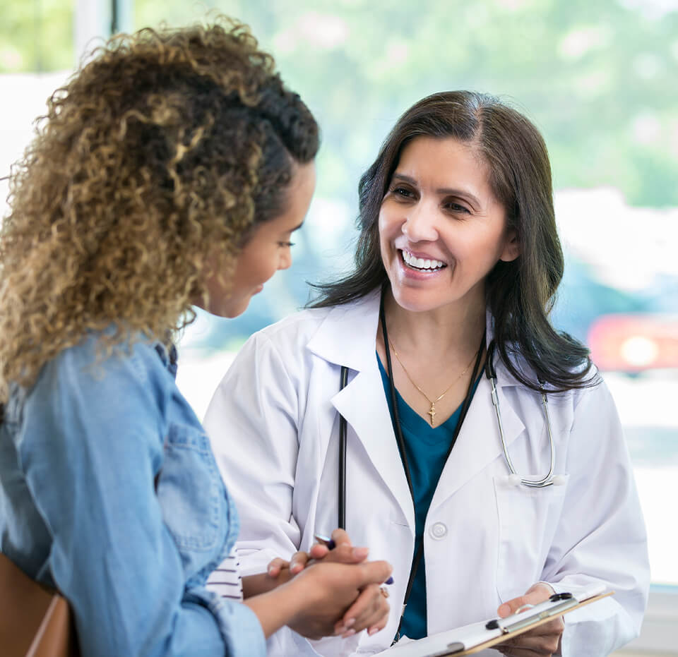 obstetrician gynecologist talking to patient